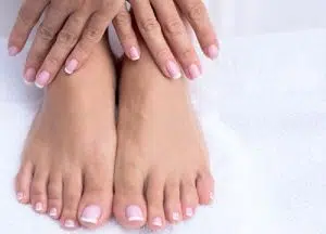 Toned and Polished | Deluxe manicure or pedicure with gel overlay